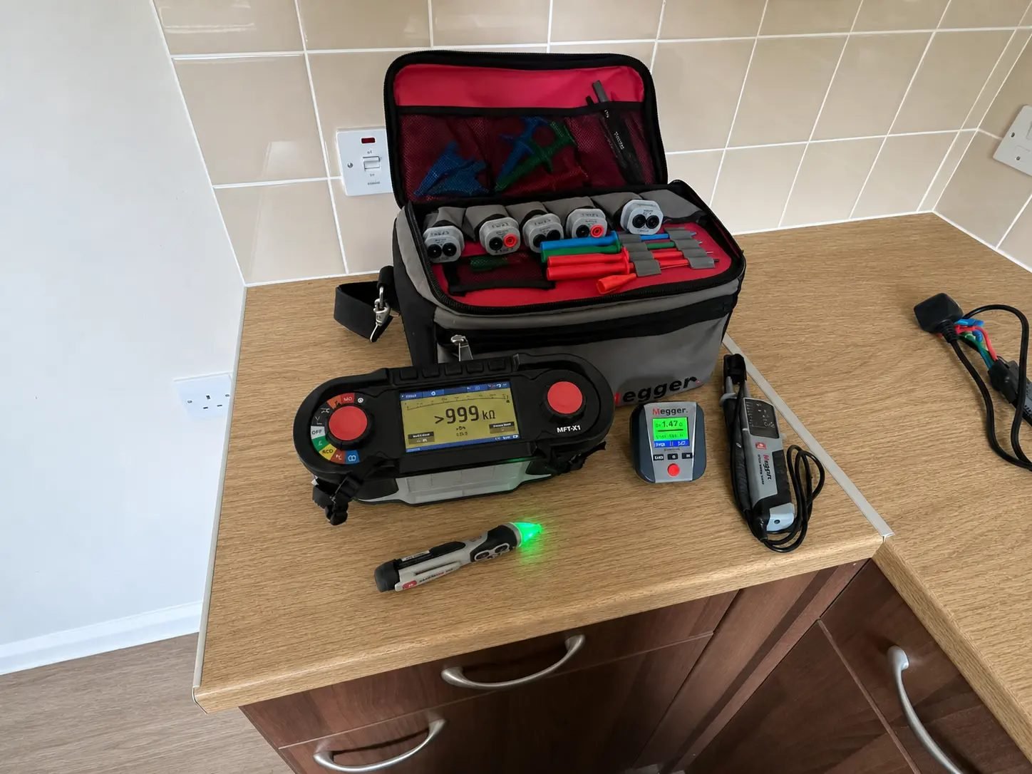 Electrician carrying out an EICR inspection on older wiring