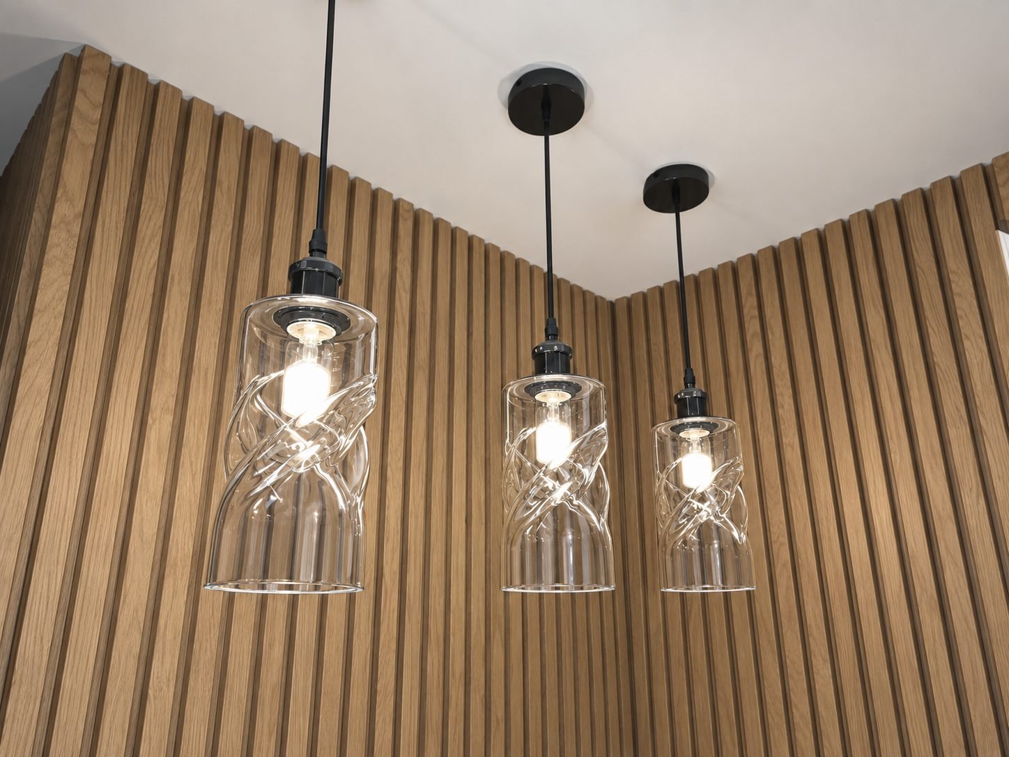 Electricians fitting ceiling lights